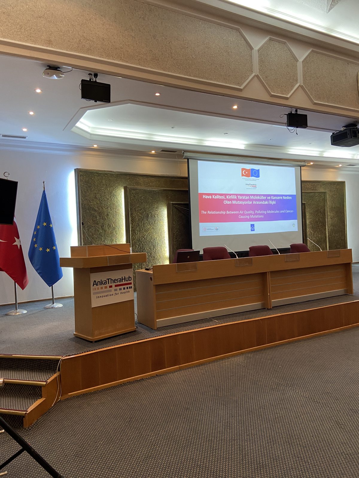 AnkaTheraHub scientific meeting: branded lectern, panel table and EU and Turkish flags